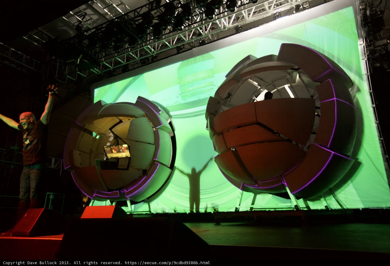 Man on Stage with Projection Screen