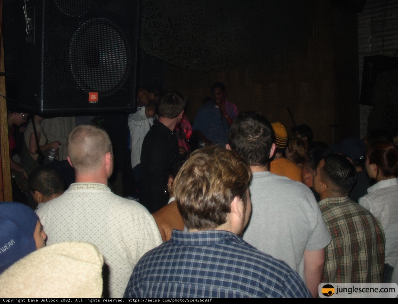 Speaker at Nightclub with Crowded Audience