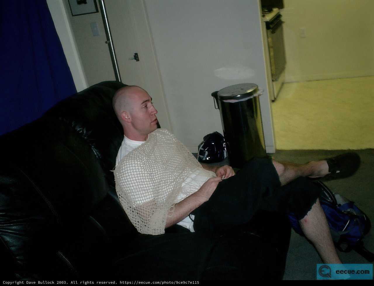 Bald Man Lounging on a Cozy Couch