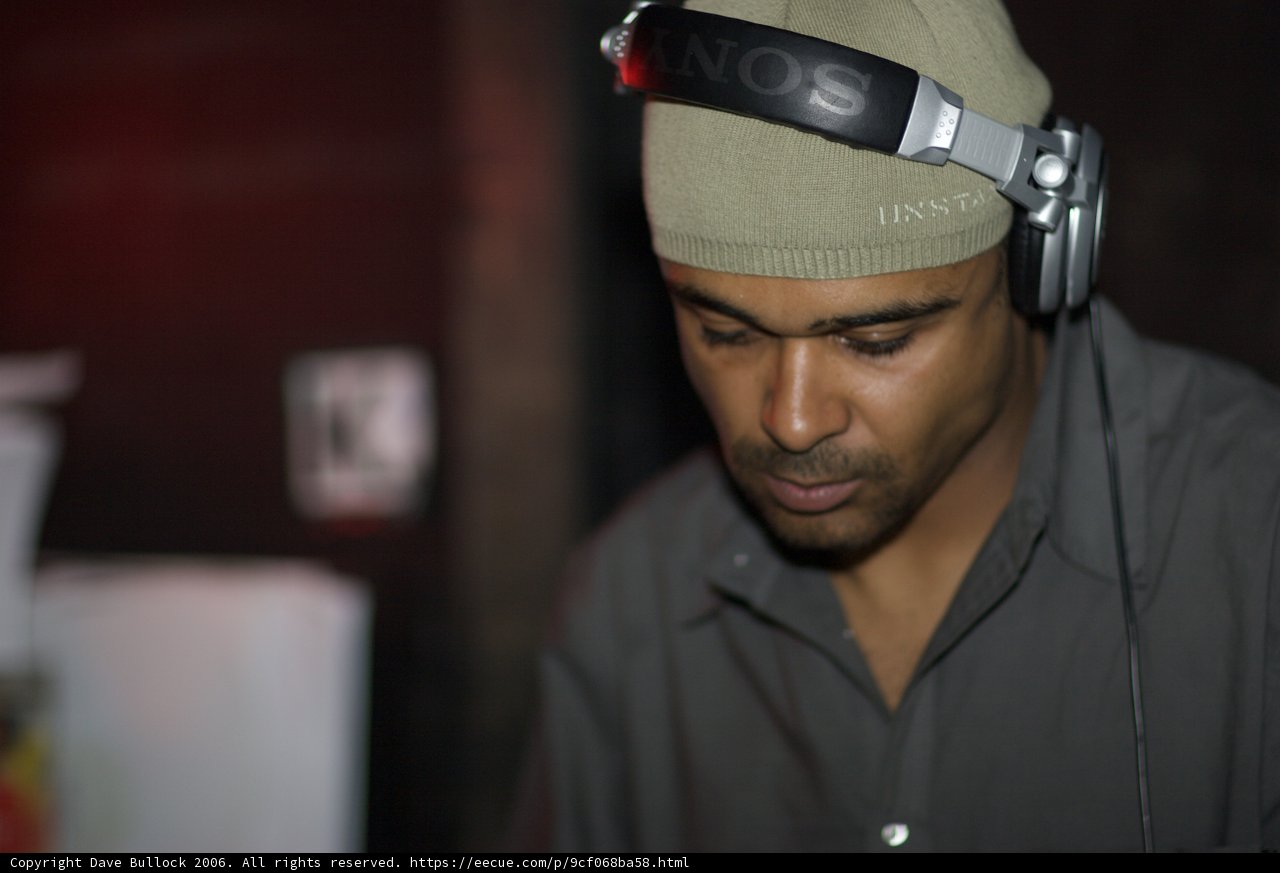 Grey-Shirted Man with Headphones