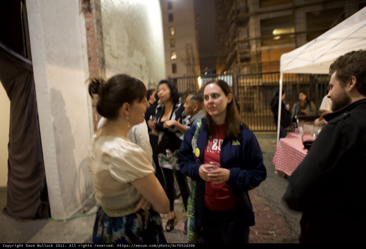 Nighttime Wine Party Gathering in Urban Alleyway