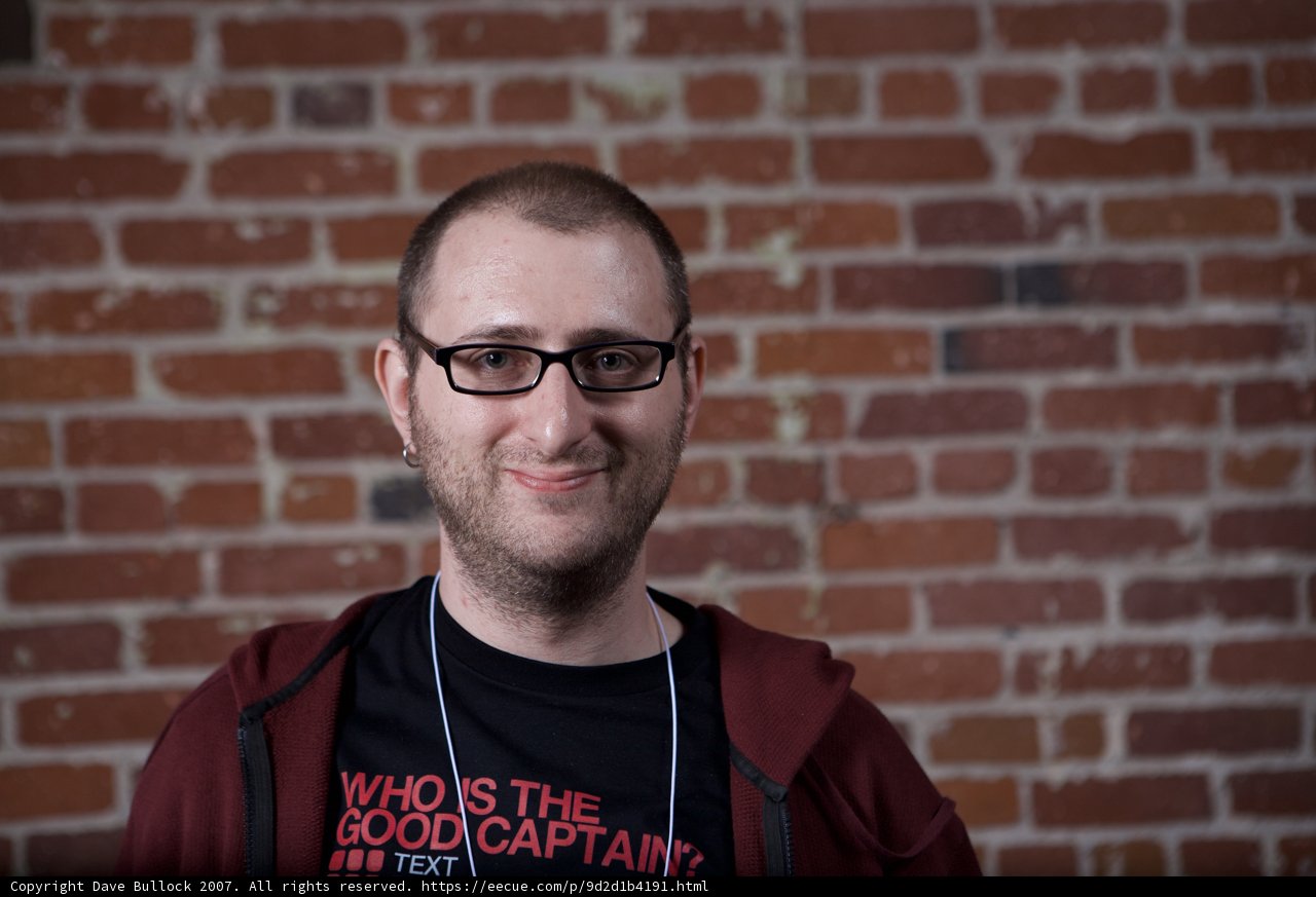 Happy Man in Red Shirt and Glasses