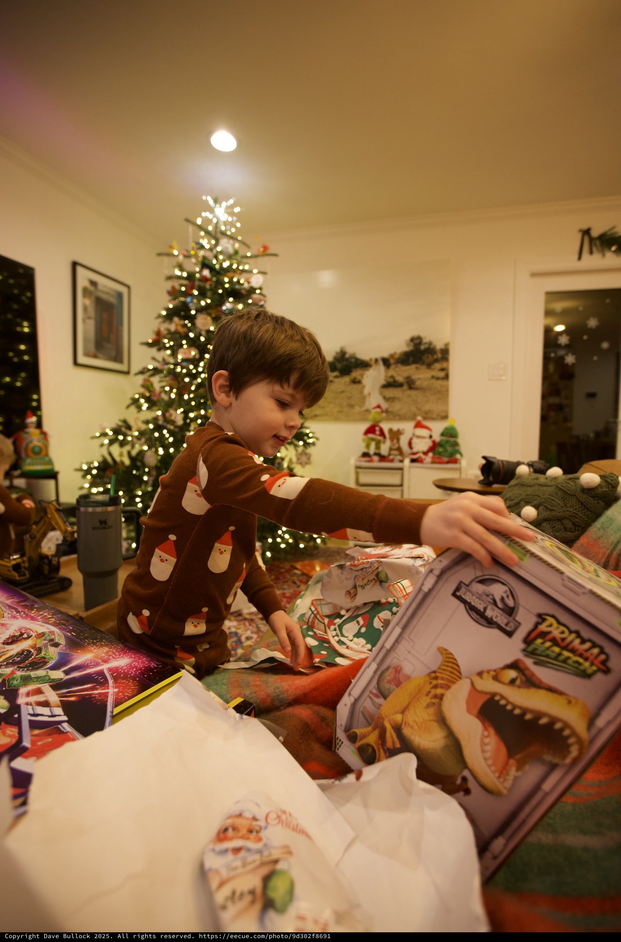 Young Boy Opening Christmas Presents on Holiday Morning