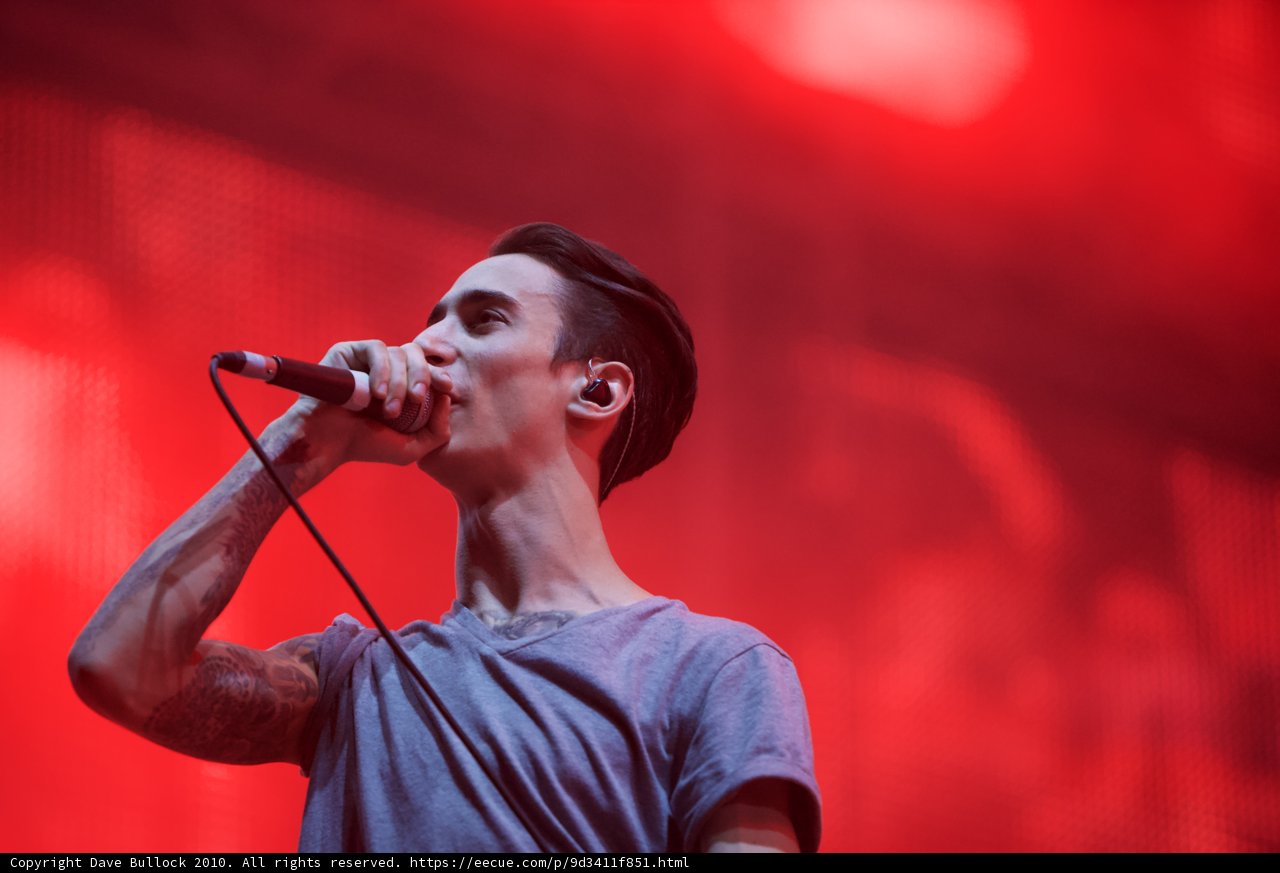 Tattooed Singer Belting out Tunes