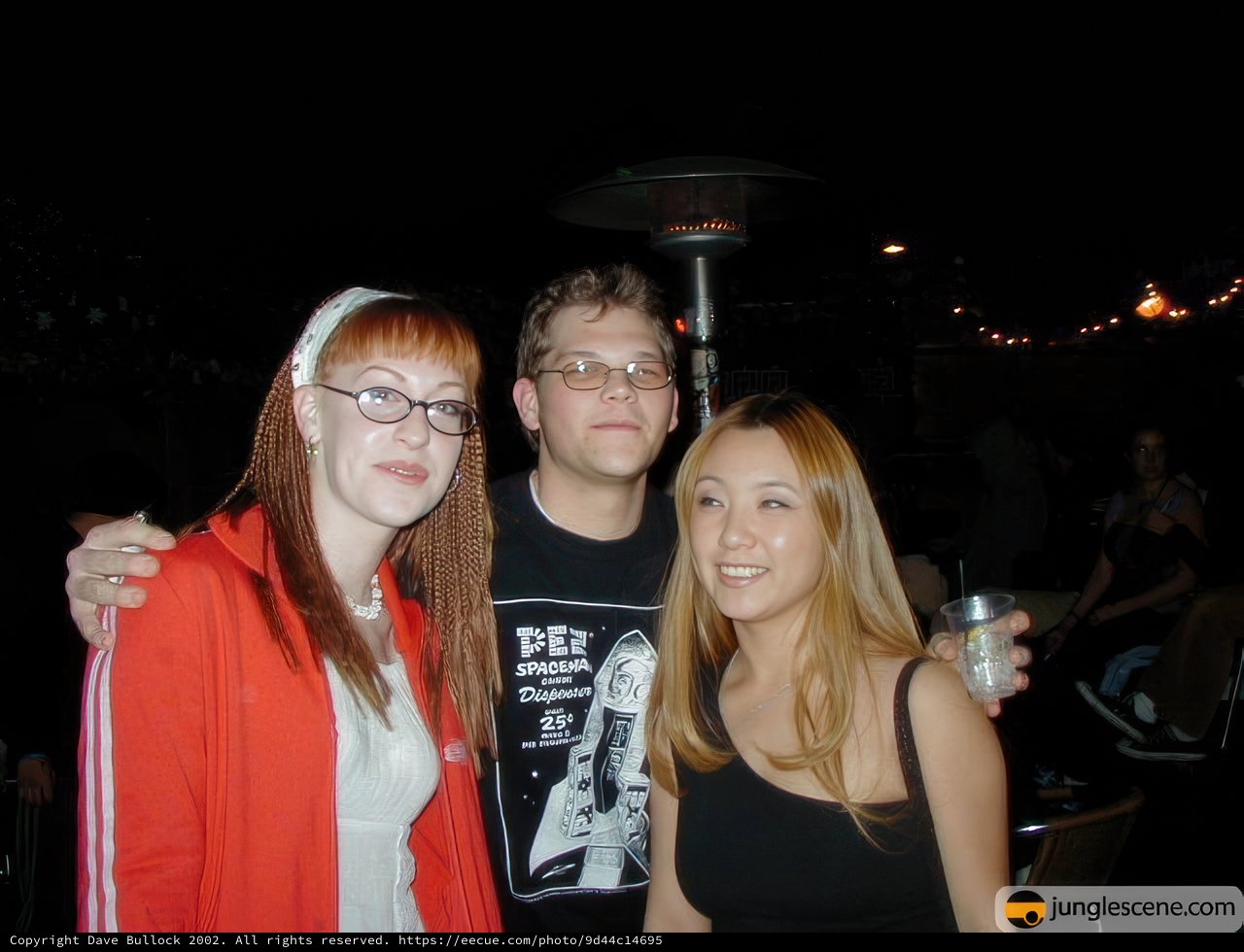 Posed Portrait of Three Adults under the Night Sky
