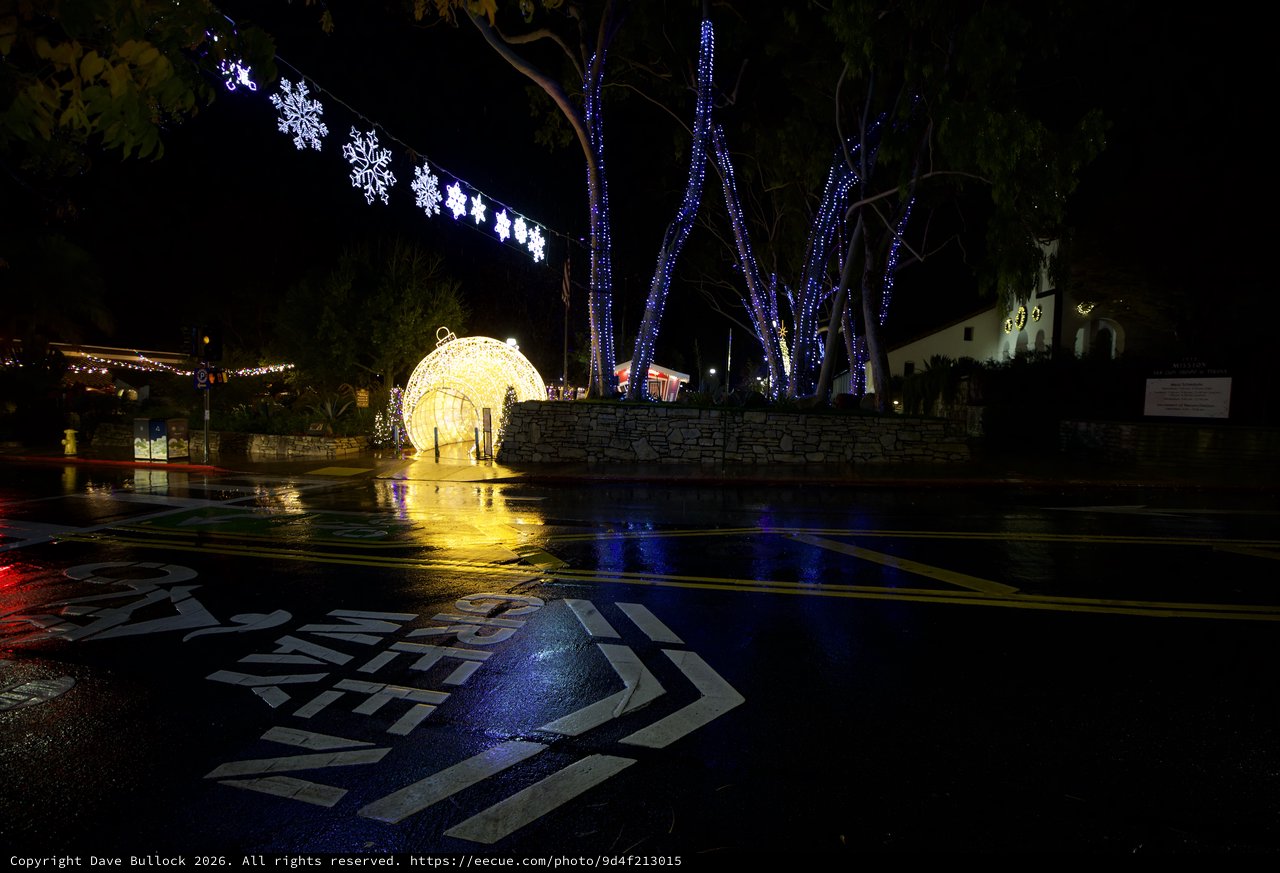 Festive Holiday Light Display on Rainy Night
