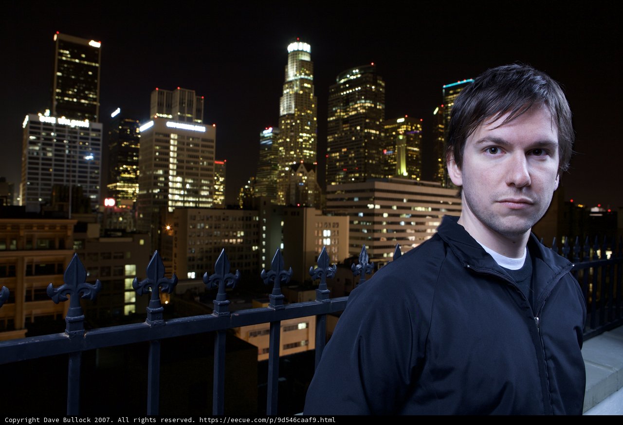 Metropolis Night: Man Standing Before the Cityscape