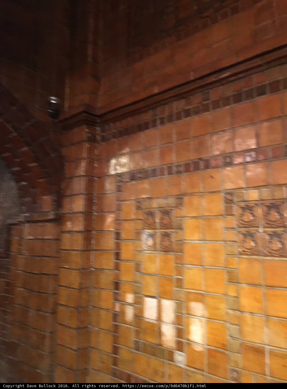 Intricate Tile Pattern on Brick Wall