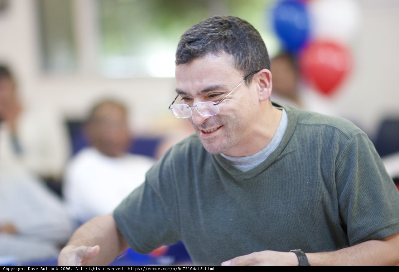 Smiling Man with Glasses