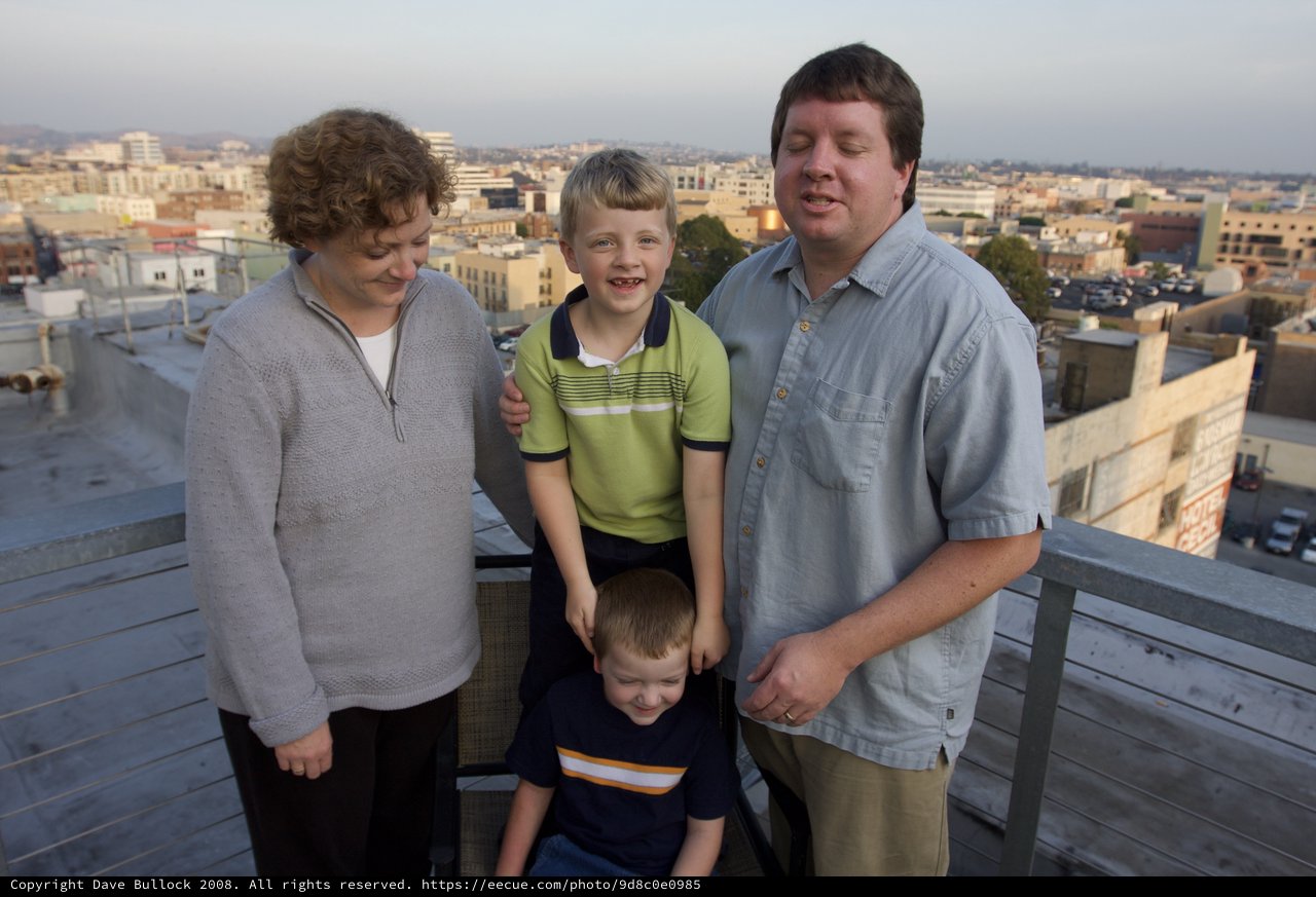 Family Portrait on Urban Rooftop at Dusk