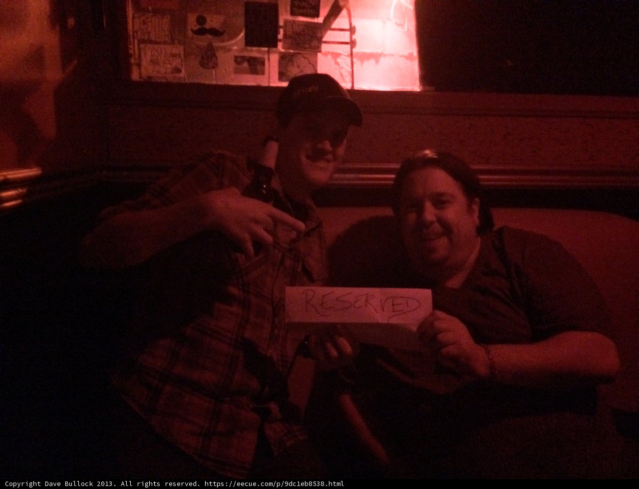 Two Men Reading a Mysterious Note in a Dark Room