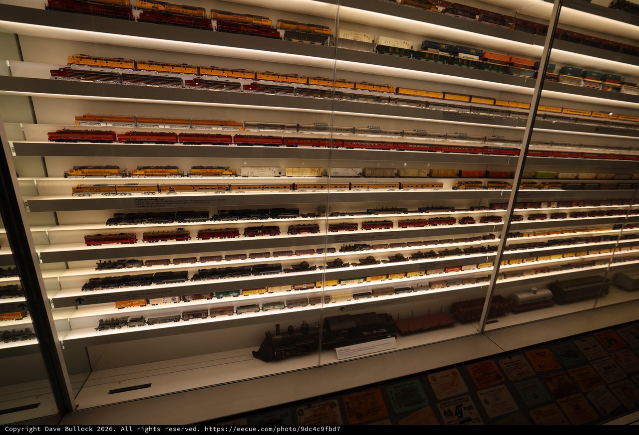 Extensive Model Train Collection Display Wall with Illuminated Shelving