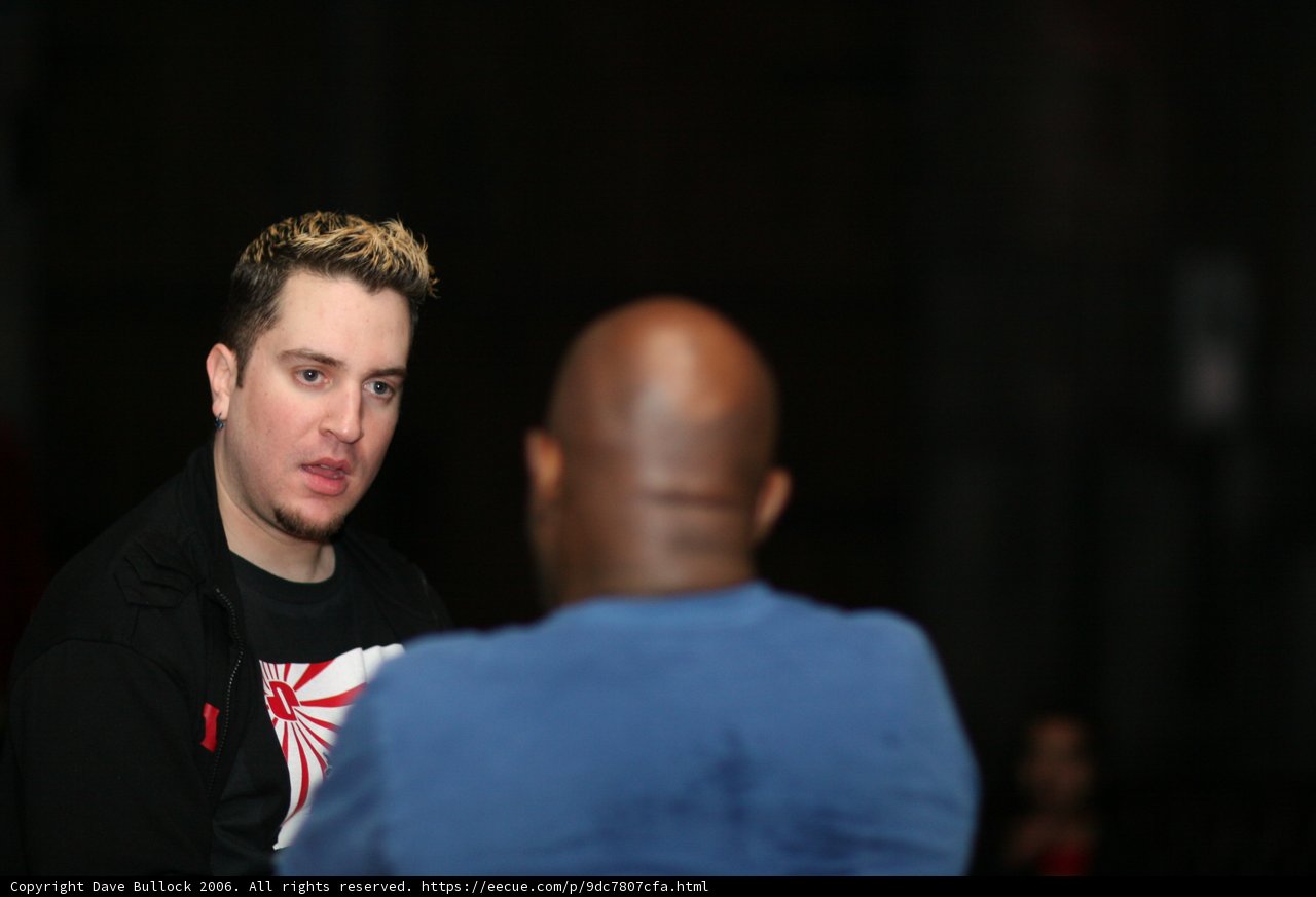 Bald Headed Man in Black T-Shirt