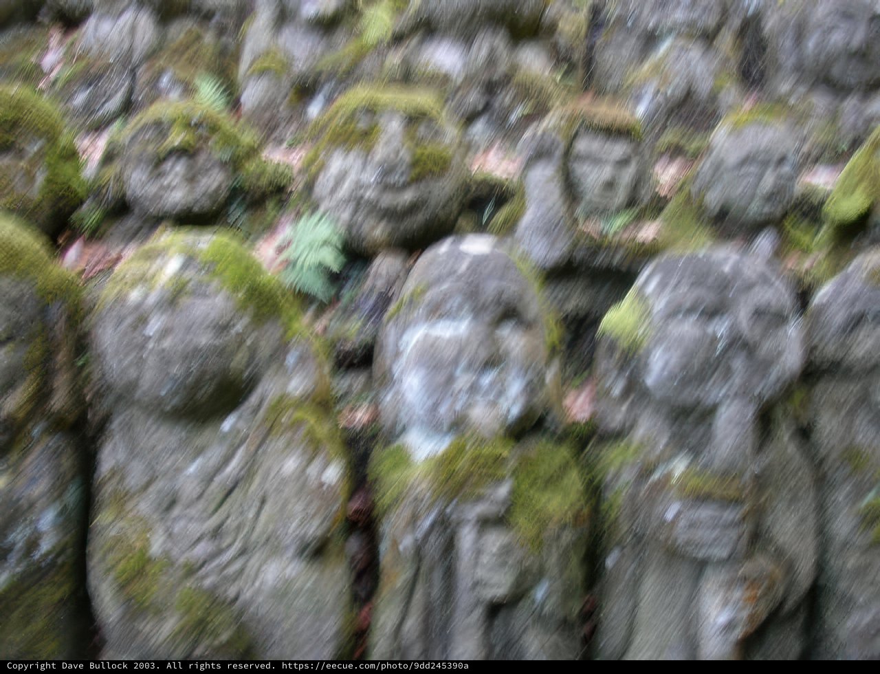 Stone Statues Covered in Moss