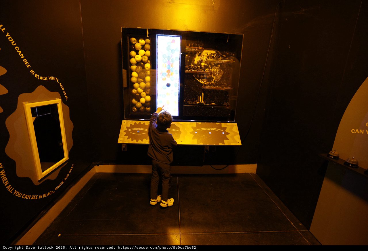 Child Exploring Interactive Space Exhibit at Science Museum