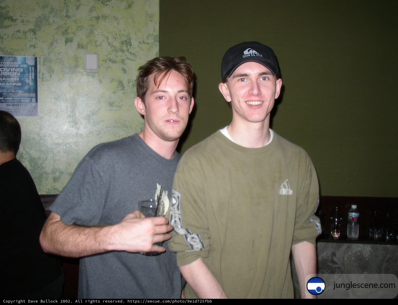 Two Young Men Enjoying a Drink Together