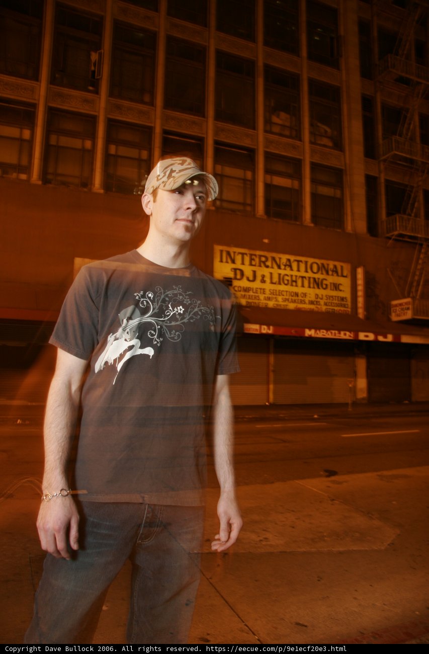 The Teenage Boy in Front of the Wooden Building