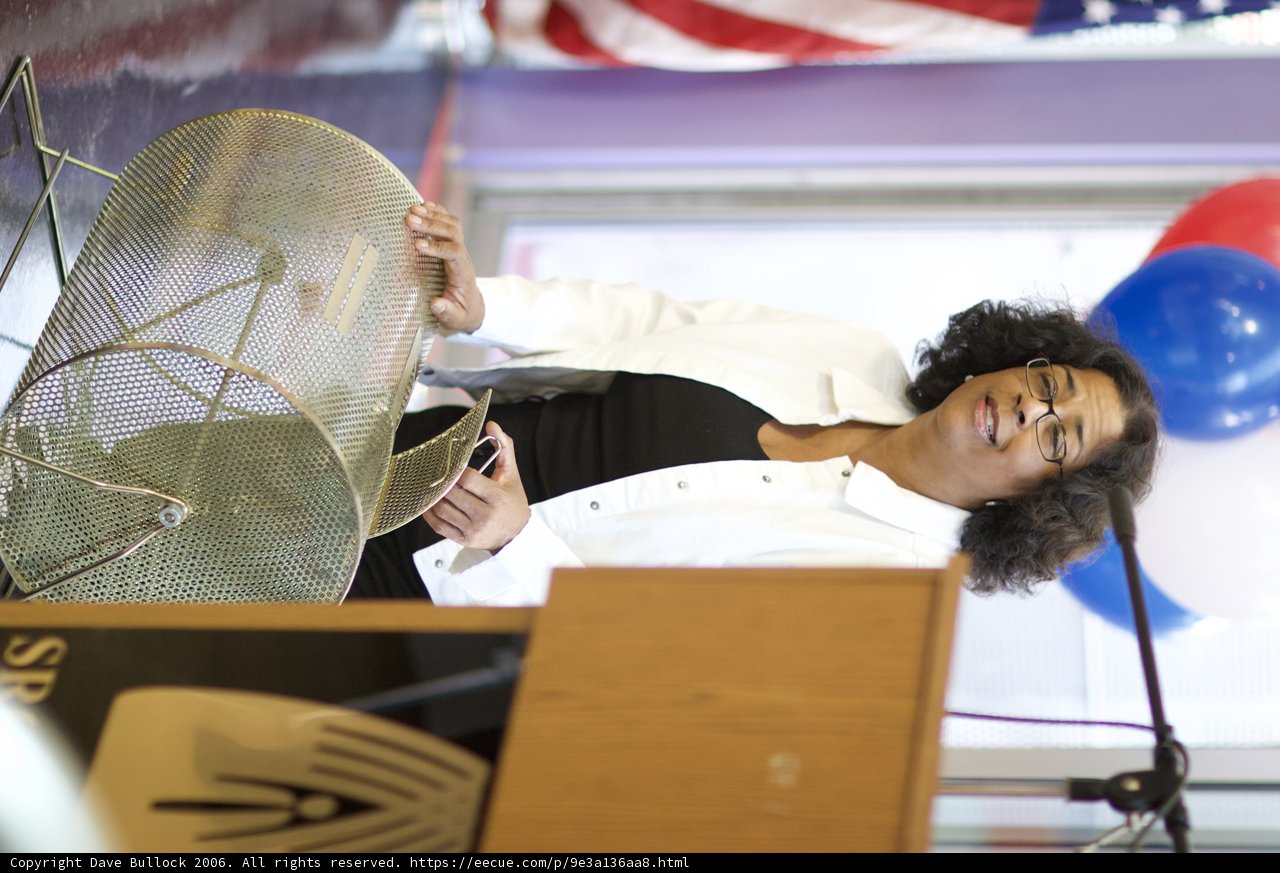 Woman with Microphone on Podium