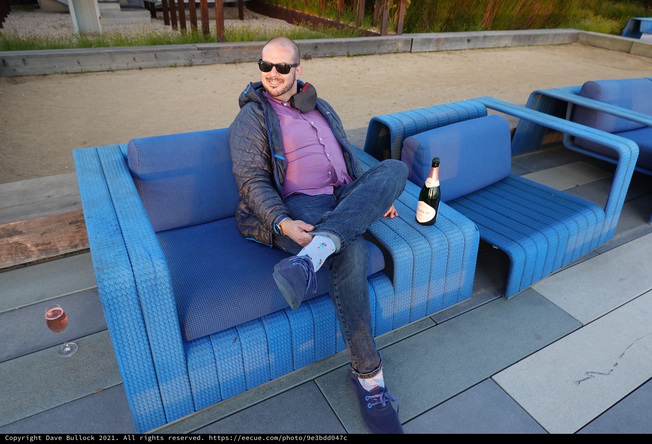 Relaxing on Blue Outdoor Furniture with Champagne