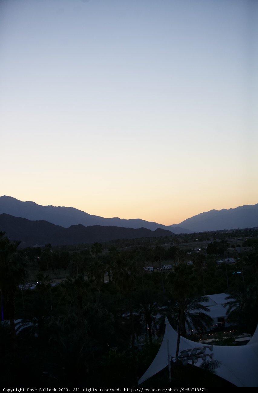 Sunset over the Mountains with Airplane Flying