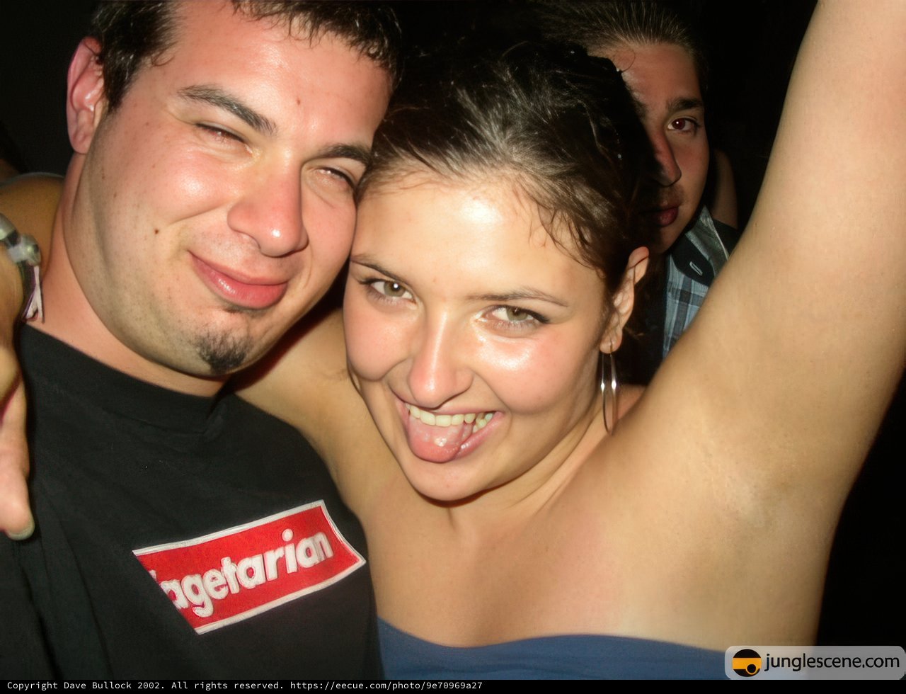Party Portrait: Smiling Bride and Groom with Friend