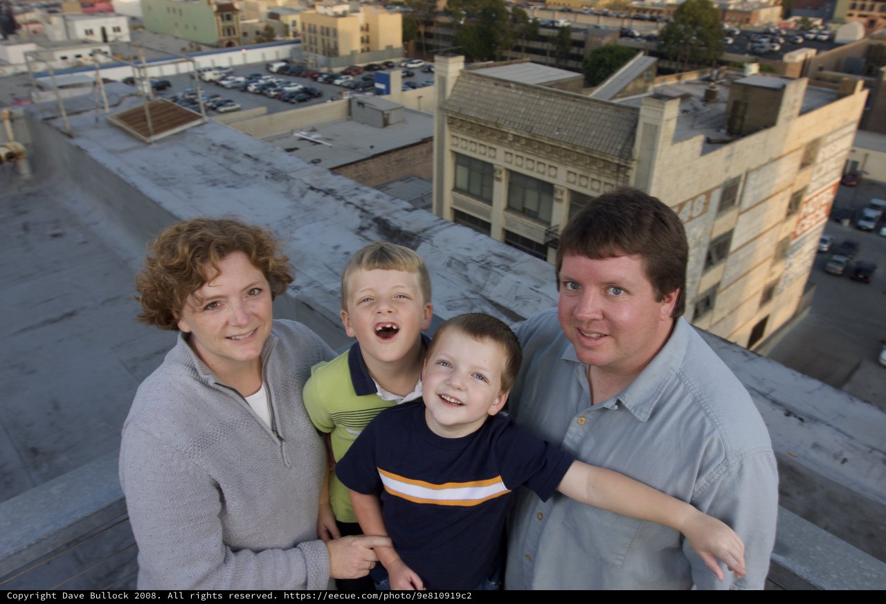 Family Portrait on Urban Rooftop at Dusk