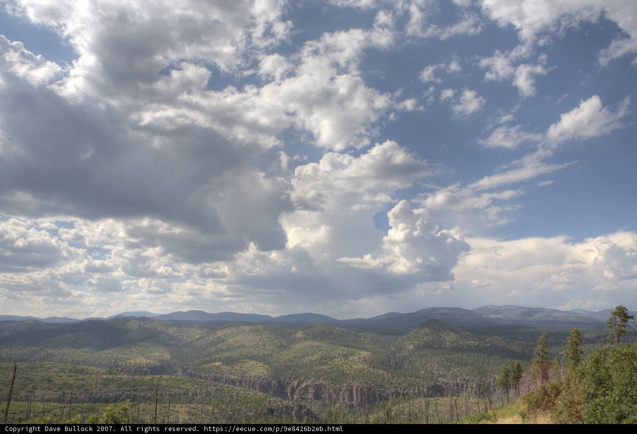Majestic Mountain Scenery Amidst Billowing Clouds