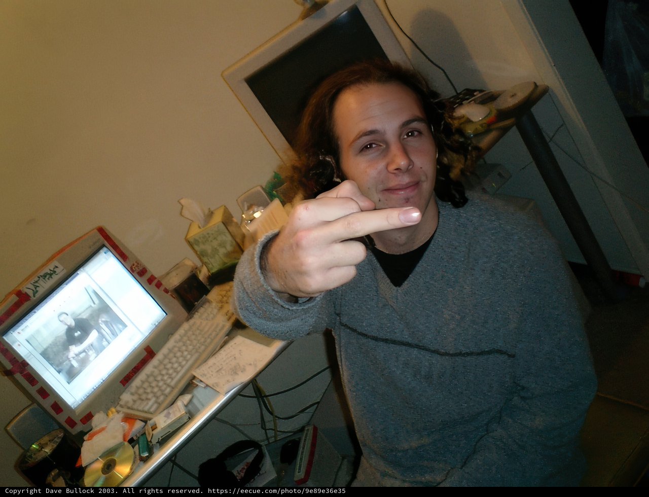 Man Points to His Screen