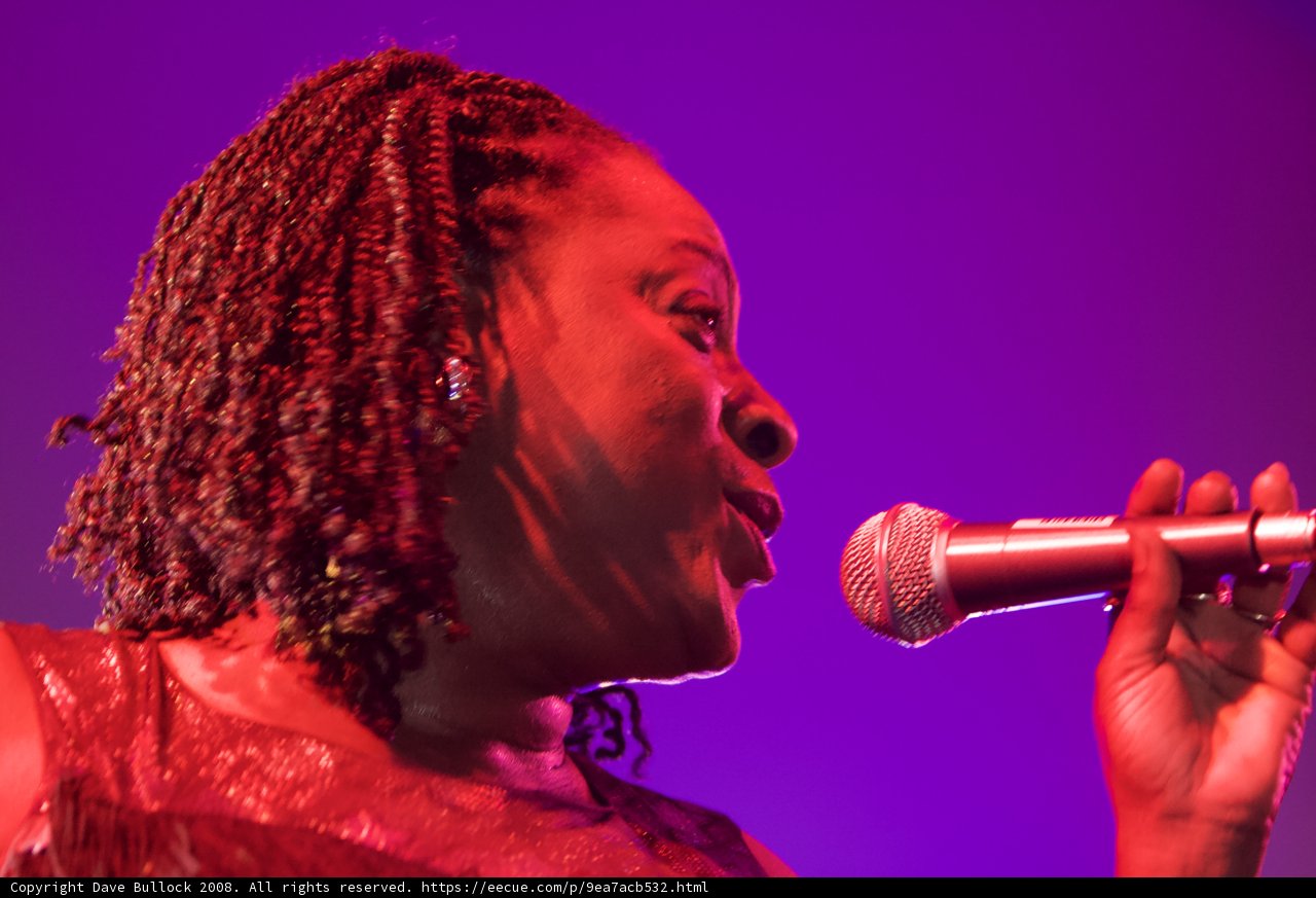 Center Stage: A Talented Woman Belting Out Her Tunes