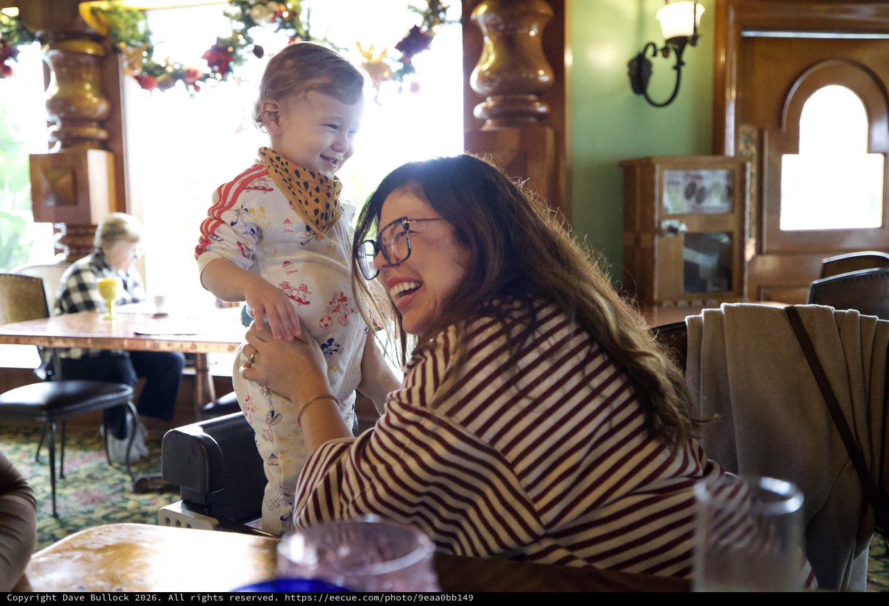 Joyful Mother-Daughter Moment at Restaurant