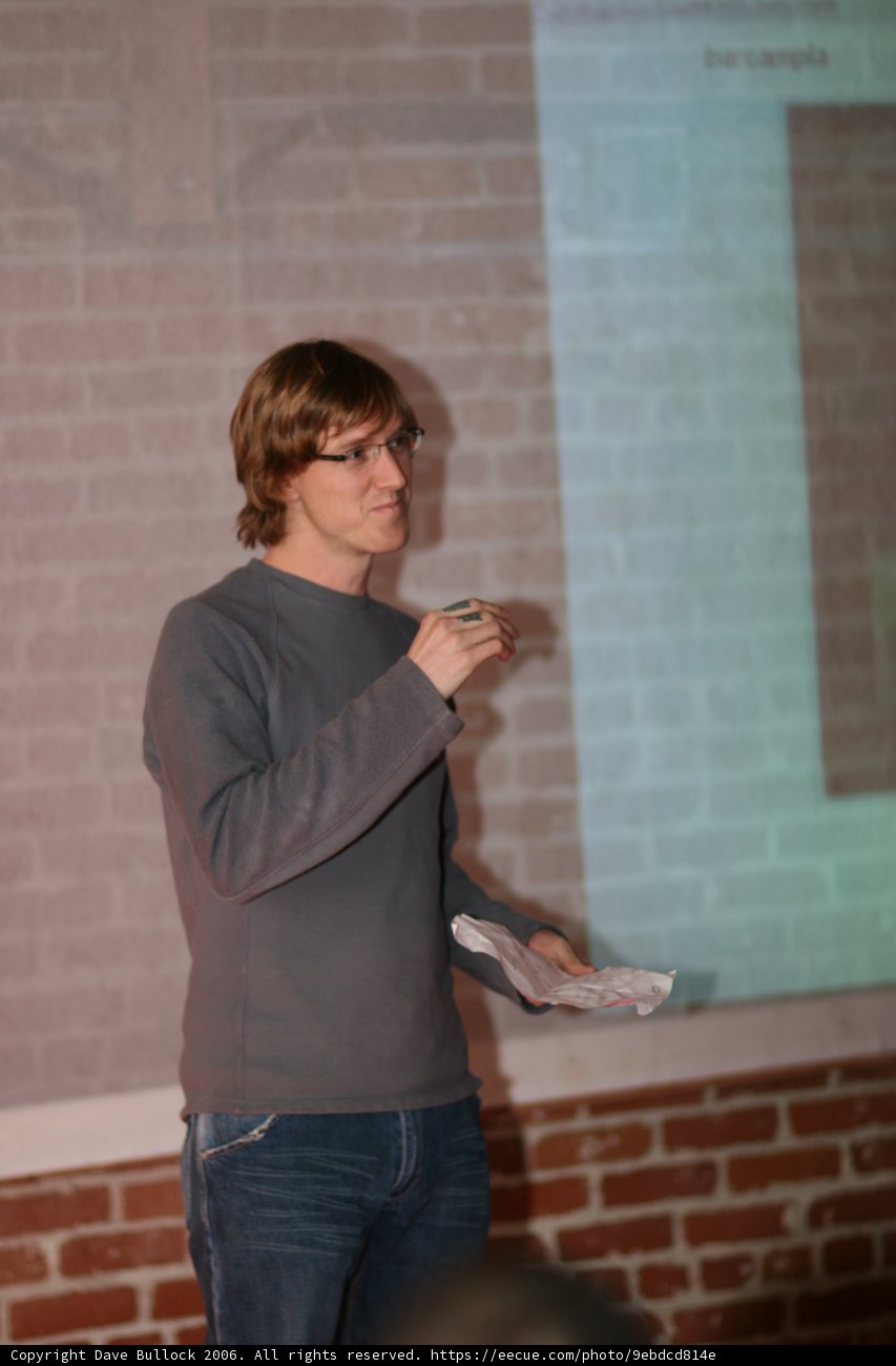 Robin Laing giving a lecture on stage