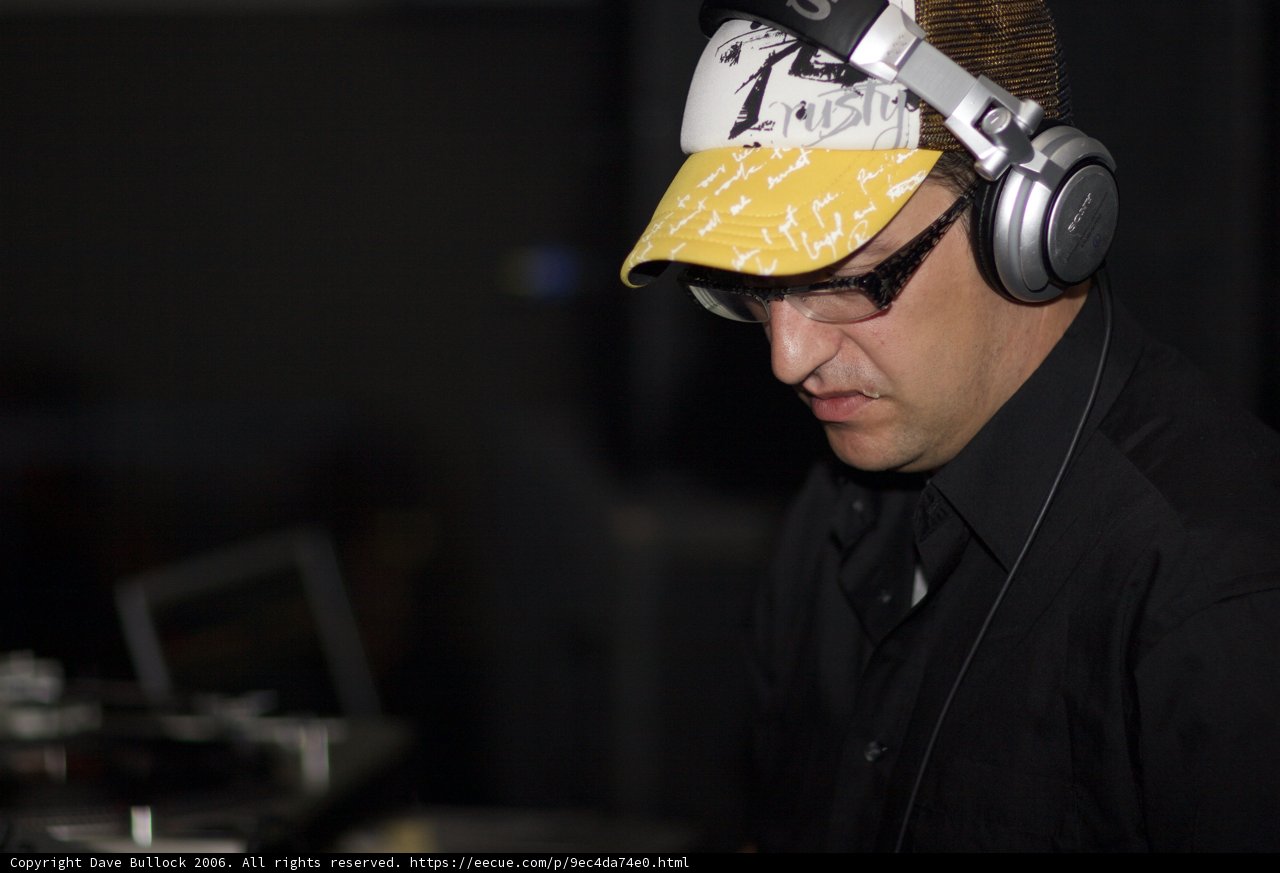 Black Shirted Man with Headgear and Glasses