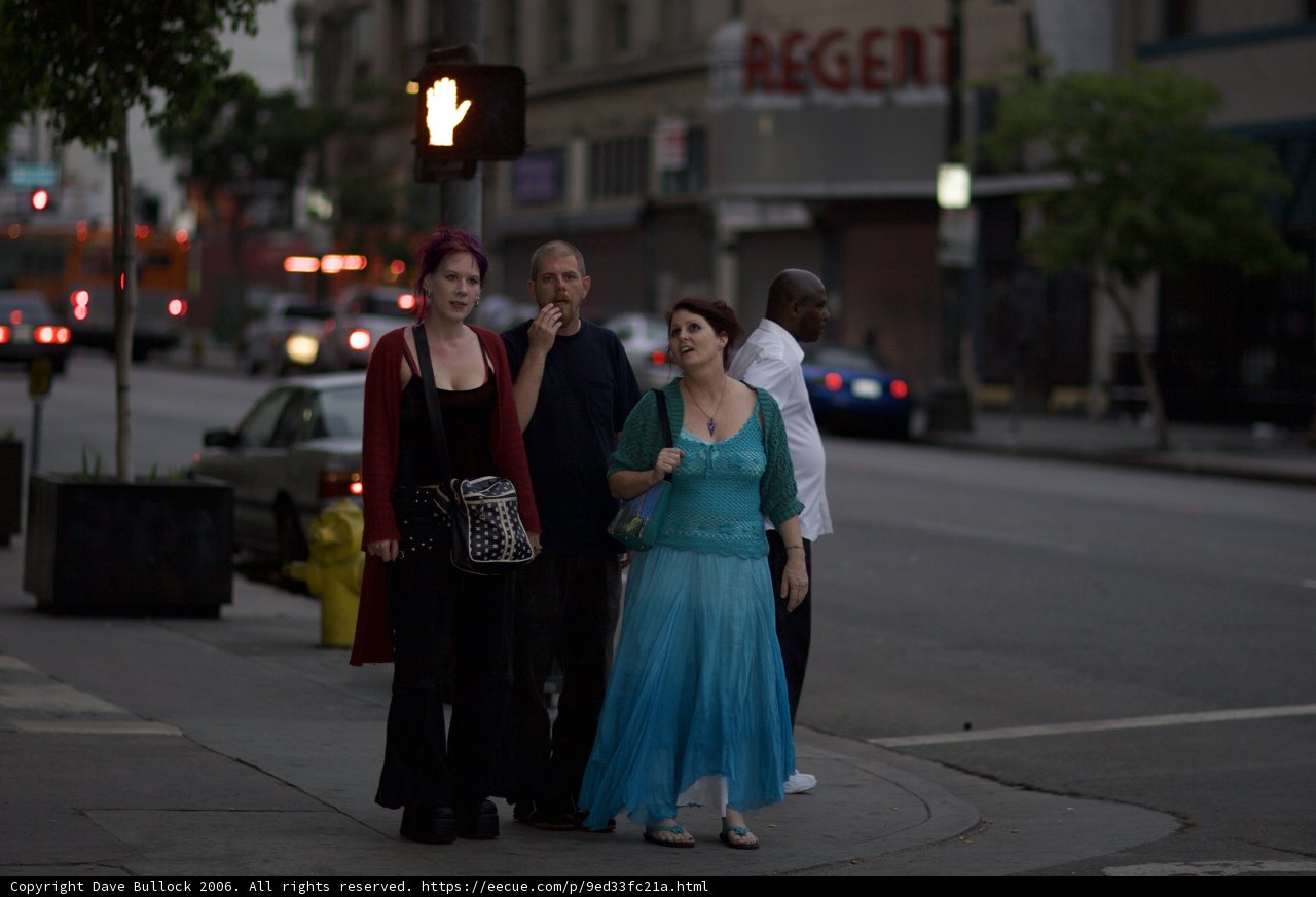 Formal Attire on a Busy Sidewalk