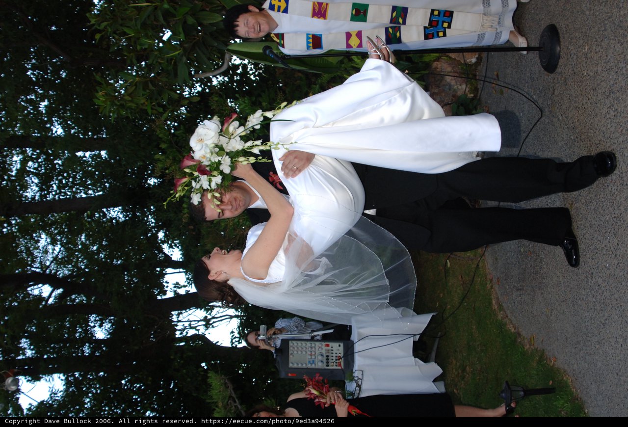 Groom Sweeps Bride Off Her Feet at Outdoor Wedding