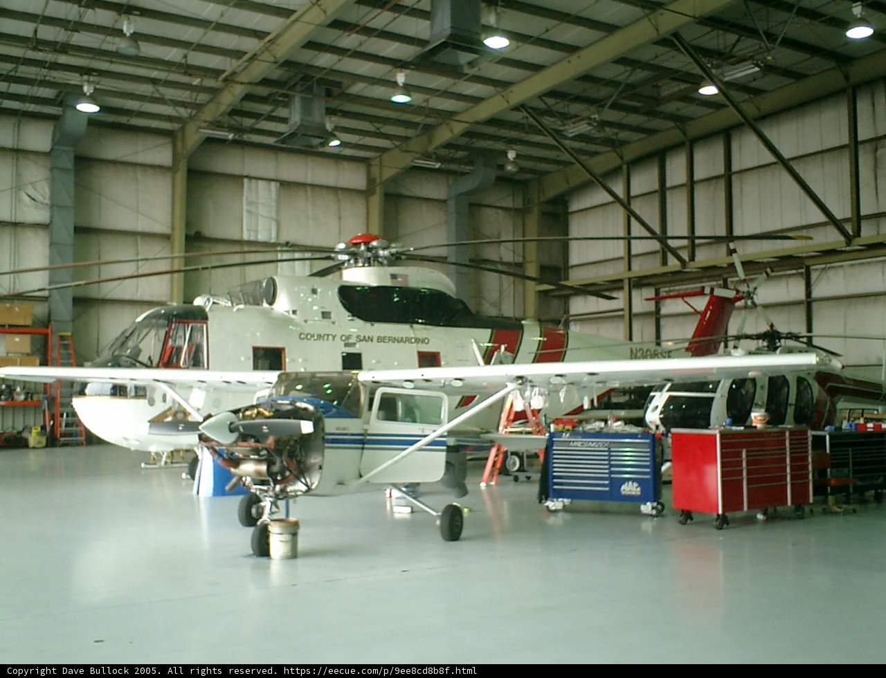 Helicopter Amongst the Aircraft in Hangar