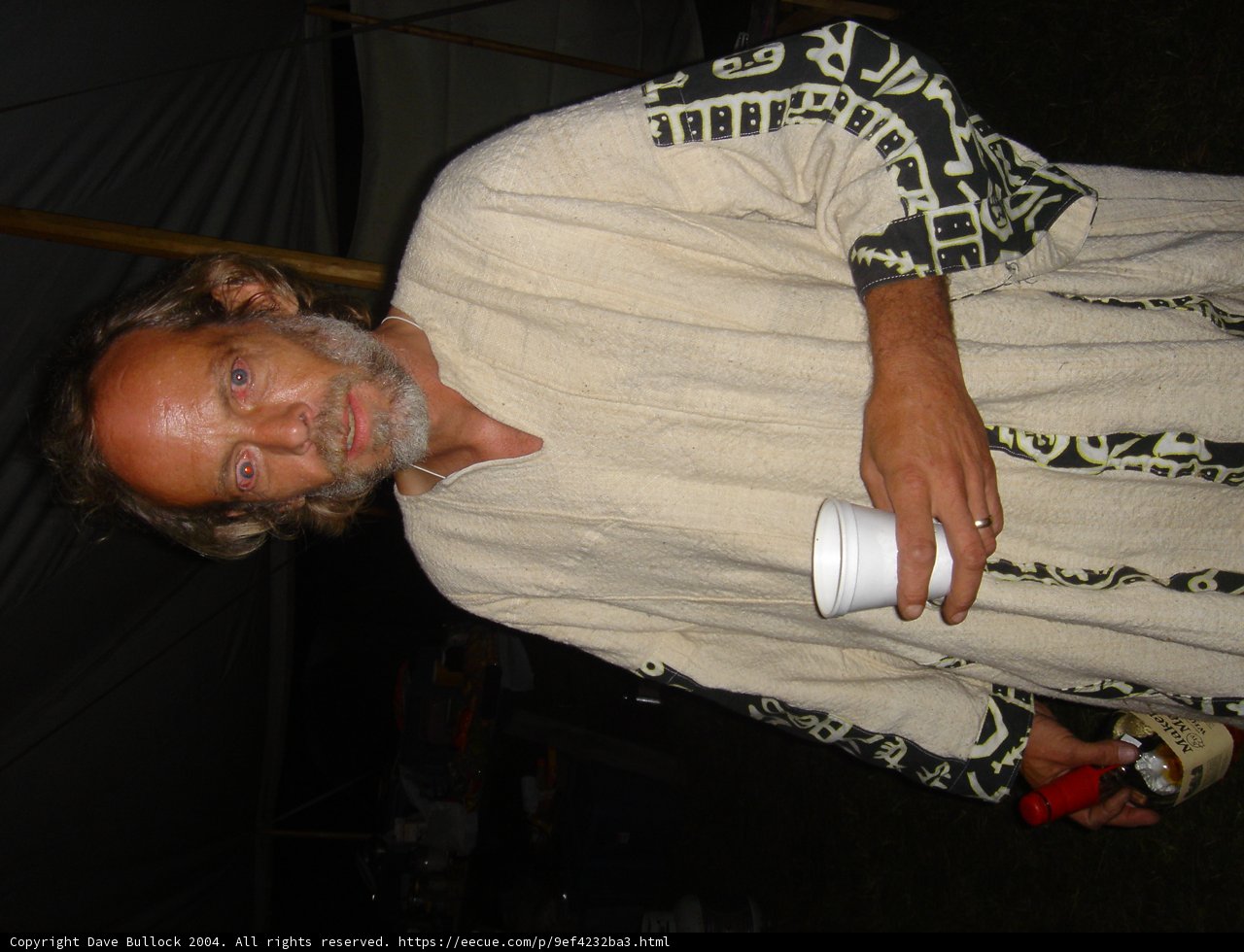 Robed Man Sips Coffee