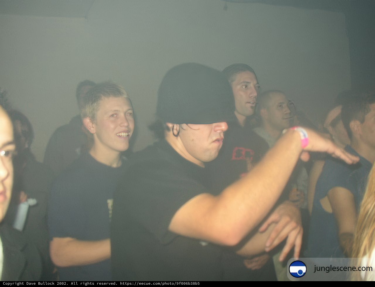 Nightclub Group Shot with Hat Guy