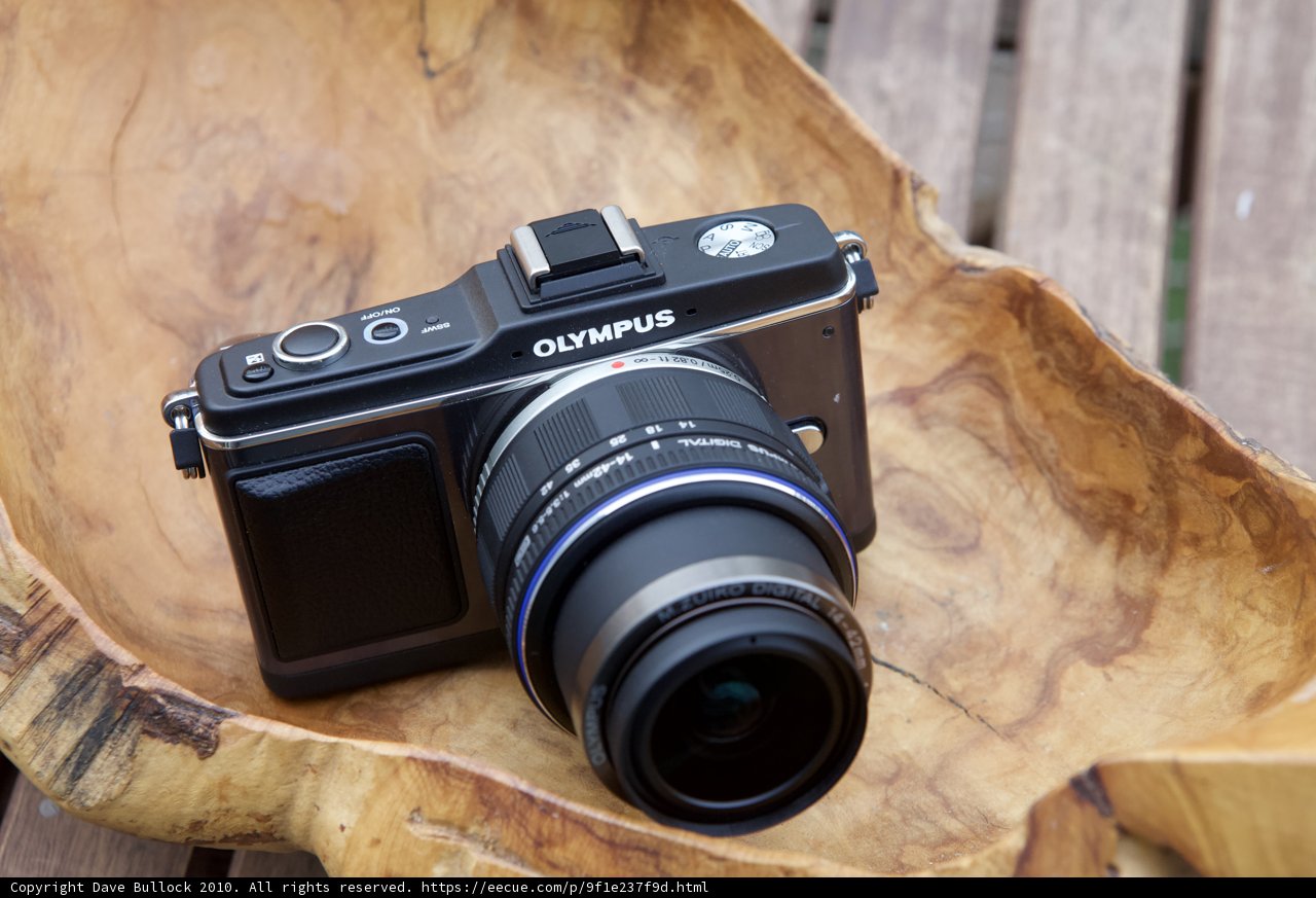 Olympus OM-D EM-5 Camera on Plywood Surface