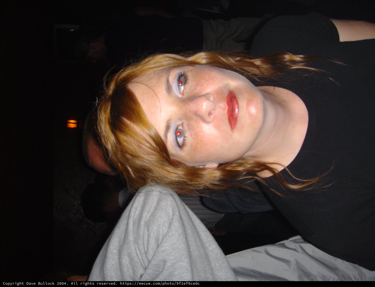 Redhead Woman with Blue Eyes at Night Event