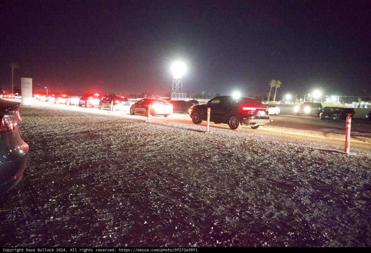 Midnight Exodus: Vehicles Under Starlit Coachella Sky