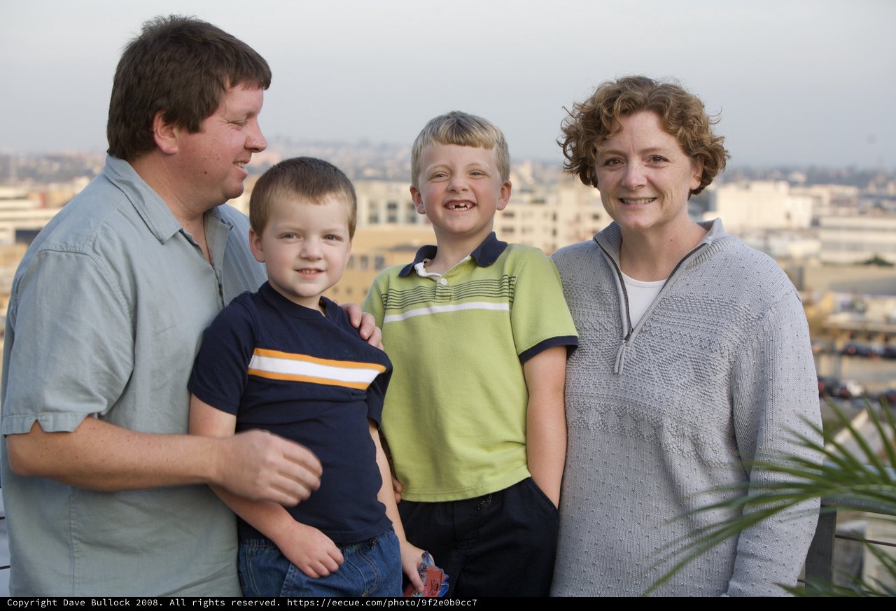 Family Portrait on Urban Rooftop at Dusk