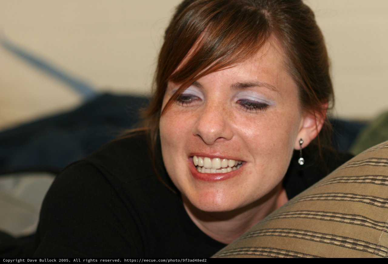 Candid Portrait of Smiling Young Woman on Couch