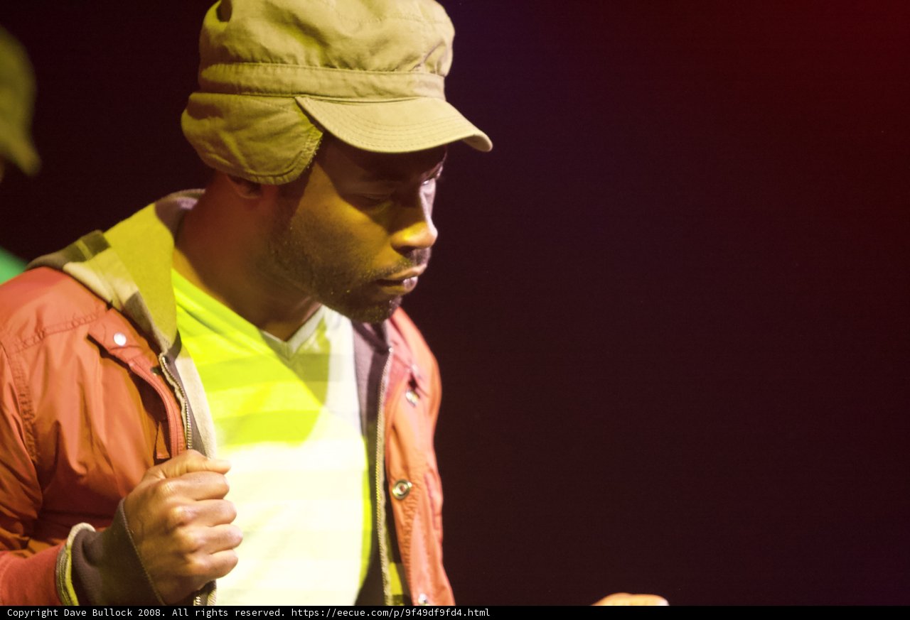 Man in Hat and Jacket Performing on Coachella Stage