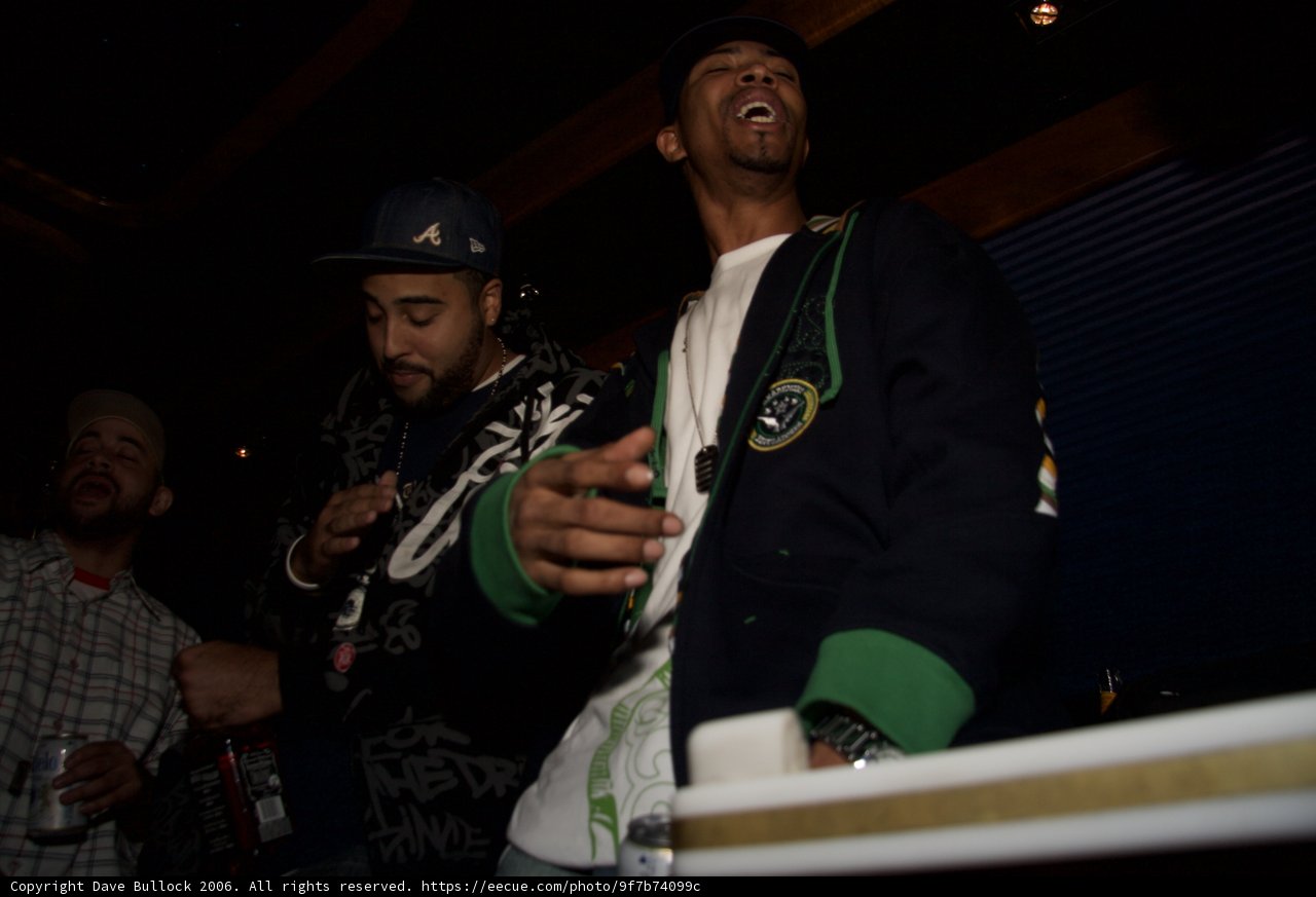 Party Snapshot with Two Men in Baseball Caps