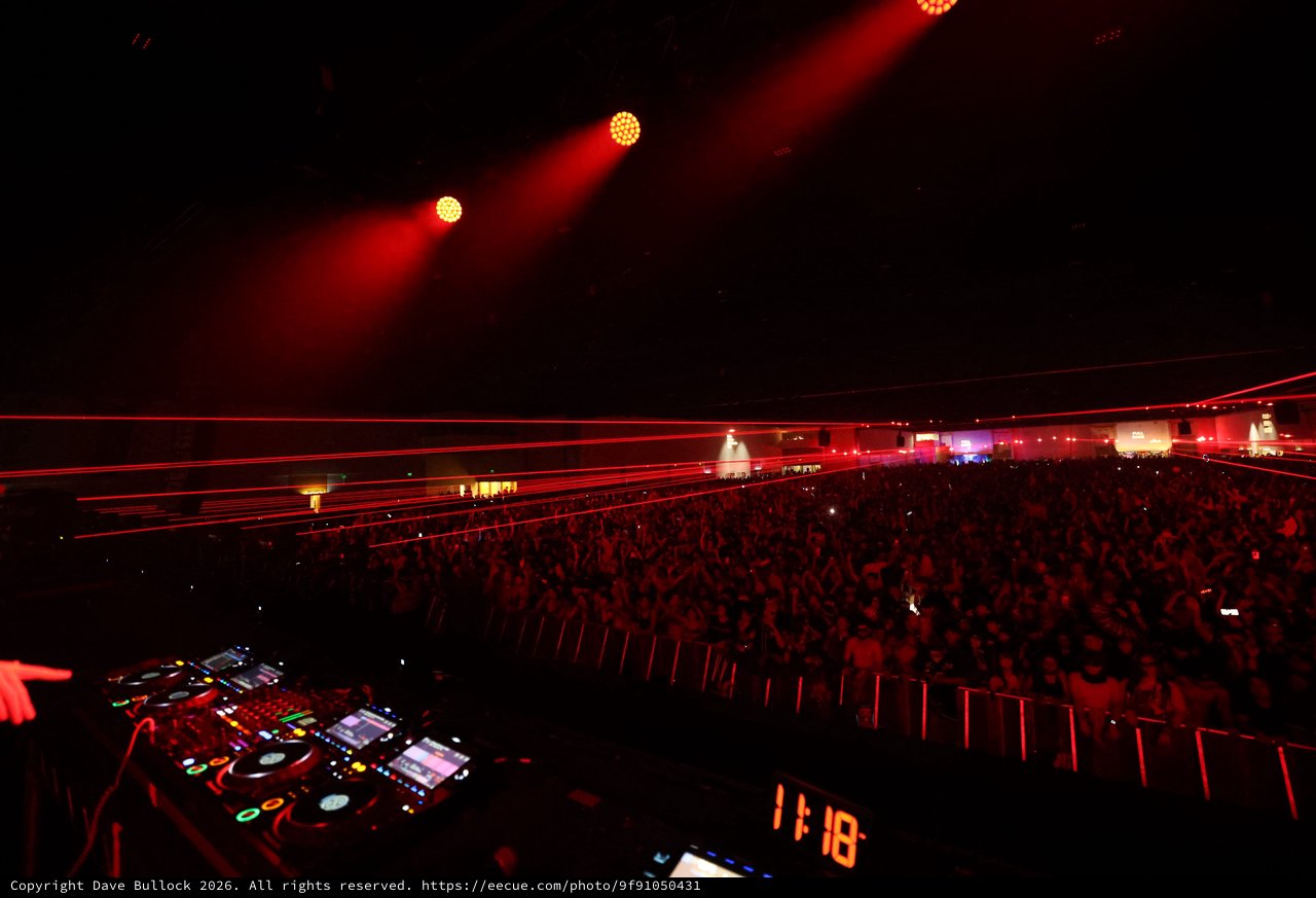 Massive Crowd Electrified by Red Laser Light Show