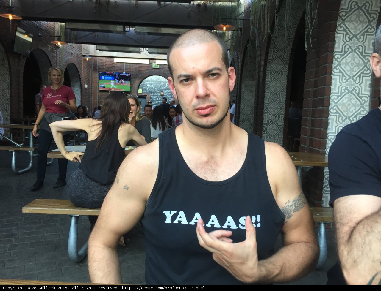 Tattooed Men in Tank Tops Strike a Pose