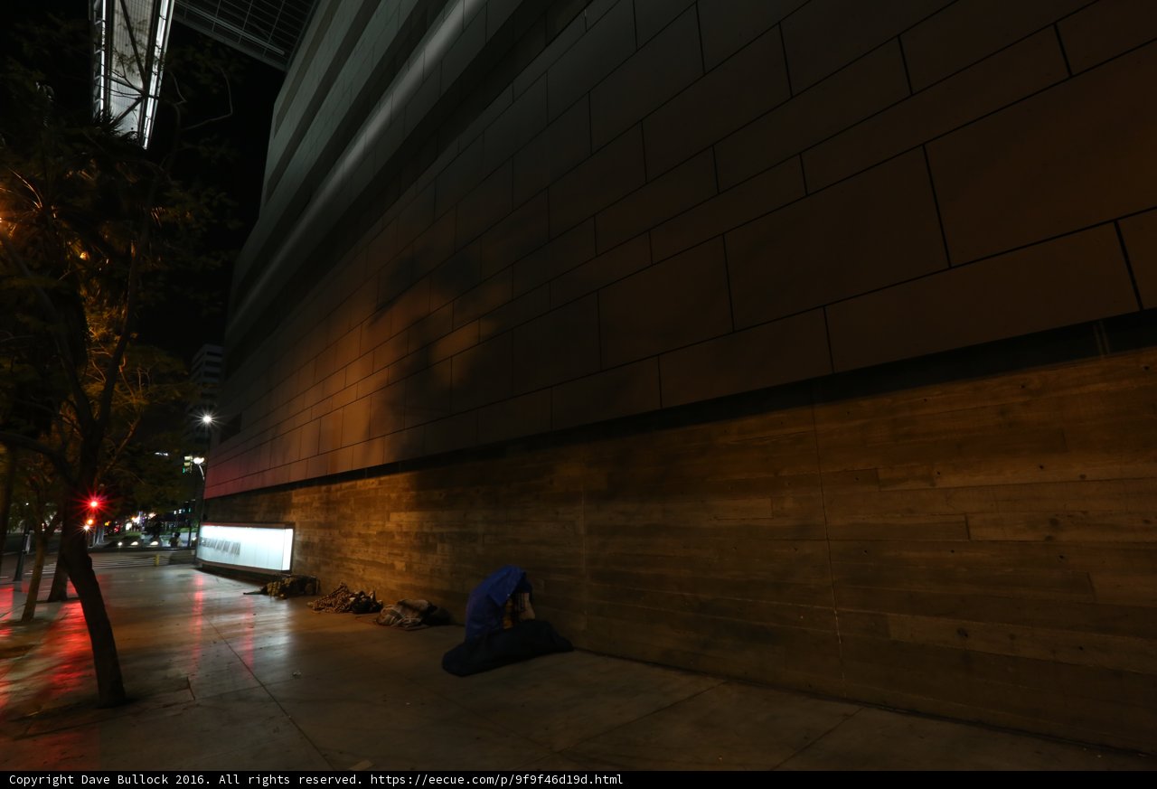 Nighttime solitude on the city sidewalk