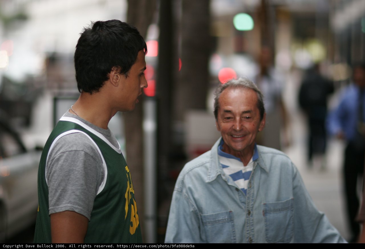 Happy Green-Shirted Man with Friends