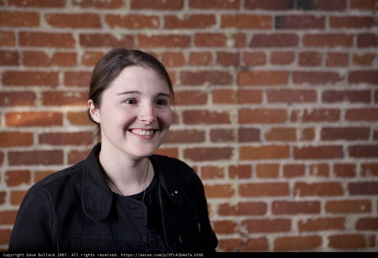 The Joyful Woman at the Brick Wall