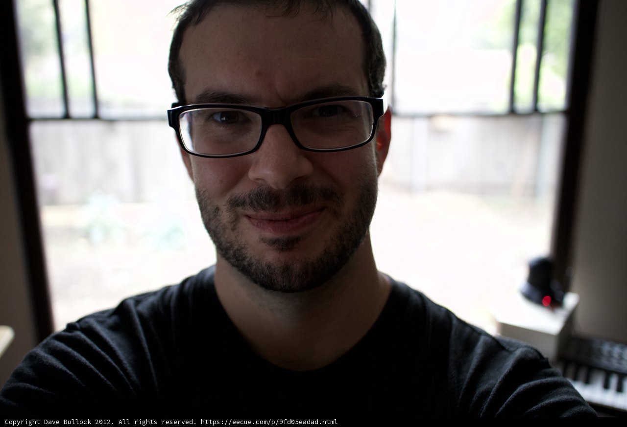 Portrait of a Happy Man with Glasses